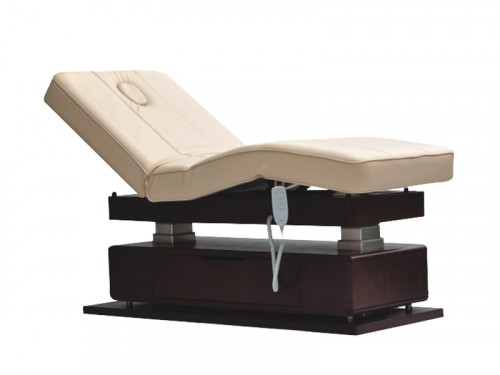 Mudit Electric Spa Massage Table in solid wood frame structure and natural wood veneer drawers and cabinet doors on either side of the table. Electrically operated table with 4 motors for electric height, electric backrest and leg rest adjustments.

https://www.spafurniture.in/products/mudit-electric-spa-massage-table/